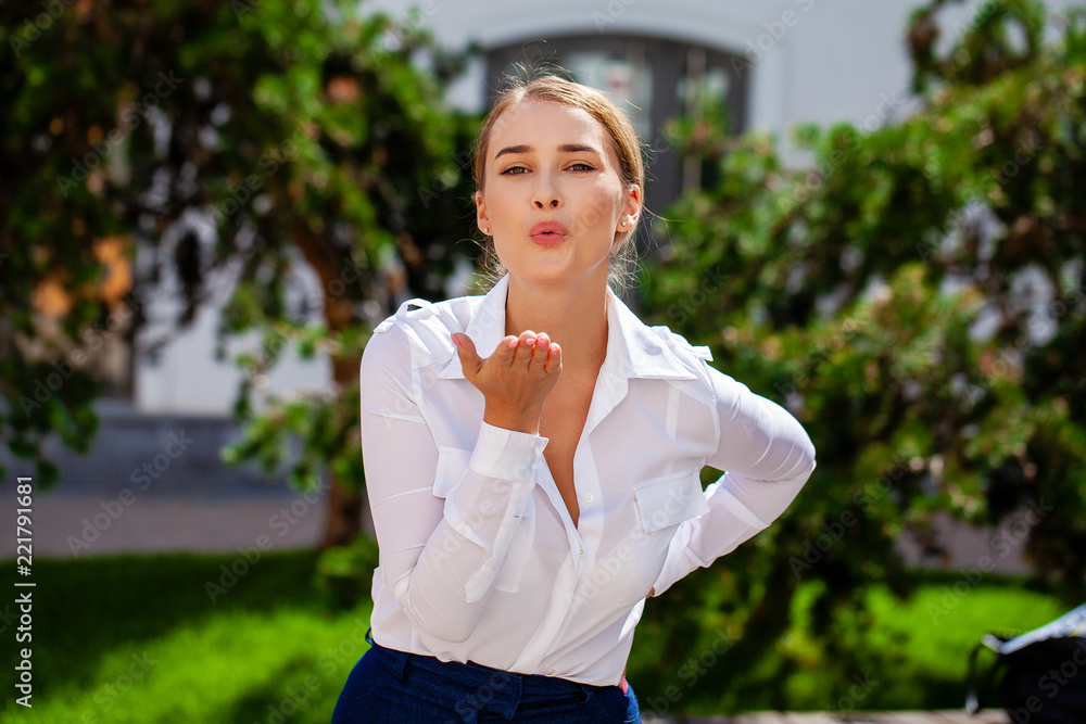 Blow kiss, young caucasian female haired model Blow kiss, young caucasian female haired model