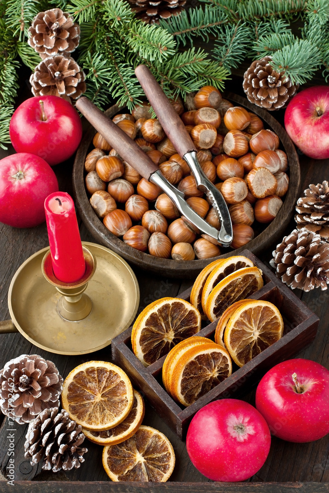 Christmas still life with apples, nuts and candle Christmas still life with apples, nuts and candle