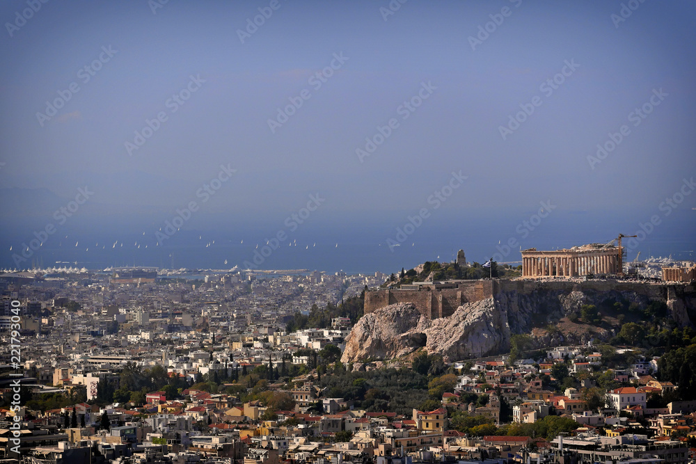 Greece, Parthenon famous temple on acropolis hill and the athenian riviera as a distant background