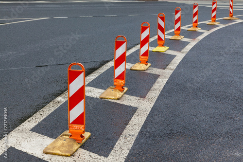 Traffic cones on asphalt road with white marking © Aleksey Sidorov