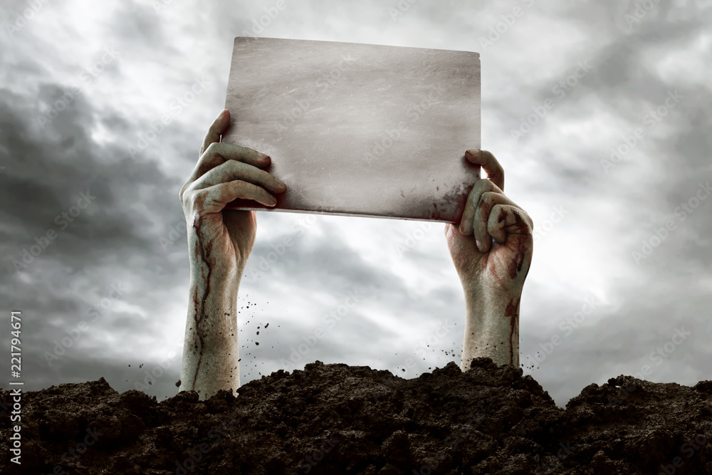 Zombie hands holding blank sign Stock Photo Adobe Stock