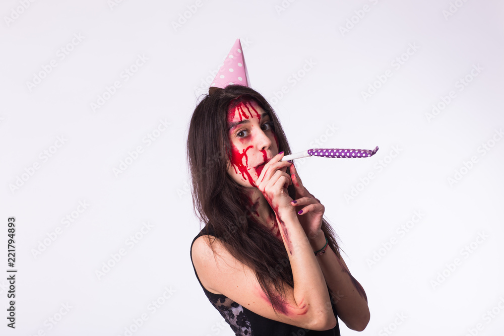 Halloween zombie bloody brunette woman celebrate holidays with whistle on white background Halloween zombie bloody brunette woman celebrate holidays with whistle on white background