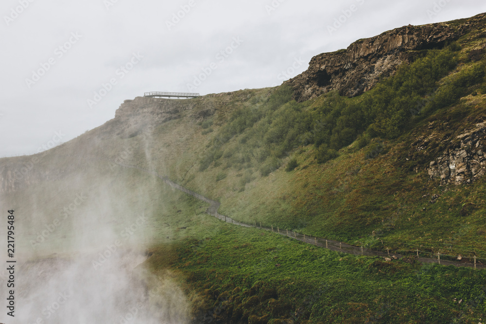 scenic view of landscape with steam and road leading through highlands in Iceland scenic view of landscape with steam and road leading through highlands in Iceland