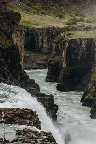 beautiful Gullfoss waterfall flowing through highlands in Iceland