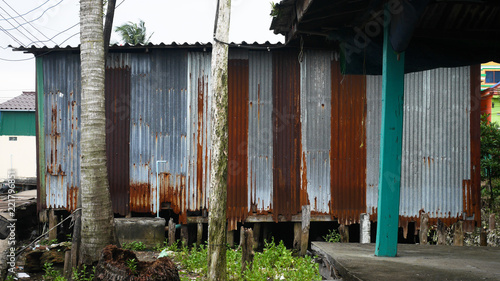 old rusty metal sheet house wall