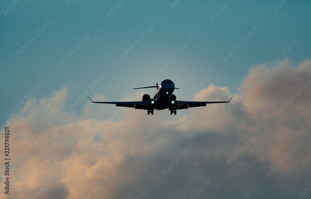 High contrast of jet plane with landing gear down
