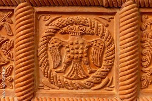 Traditional russian ornament on clay oven tiles