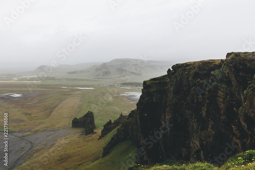 aerial view of landscape with fog over mountains in Vik, Iceland