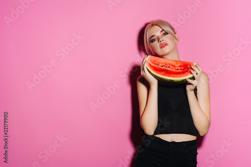portrait happy young woman is holding slice of watermelon. Taste of watermelon. Summer. Fruits.