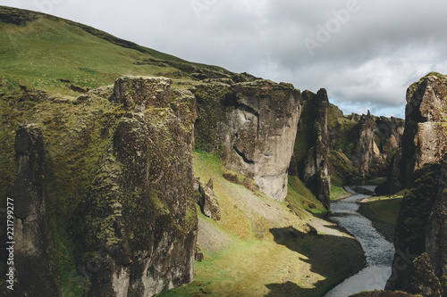 scenic view of beautiful mountain river flowing through highlands in Fjadrargljufur Canyon in Iceland