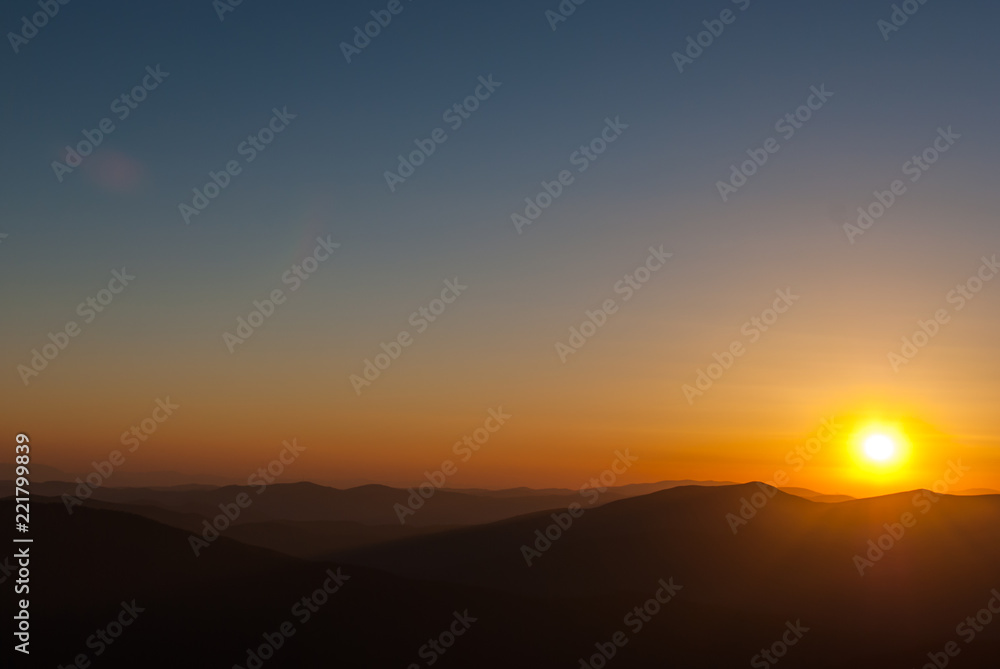 Ukrainian Carpathians over sunset background