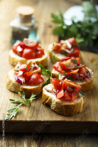 Tomato bruschetta with red onion and parsley