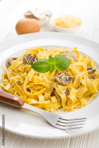 Tagliatelle pasta with cheese and mushrooms