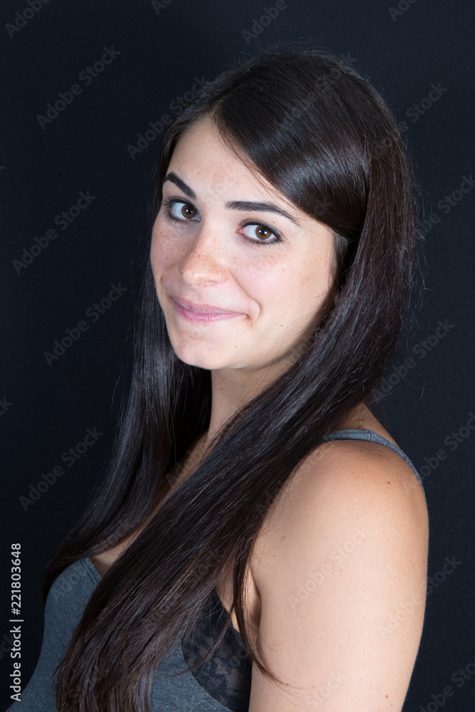 portrait of young beautiful cute cheerful girl brunette smiling looking at camera over black background portrait of young beautiful cute cheerful girl brunette smiling looking at camera over black background