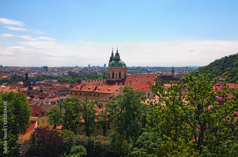 Skyline aerial view of old town Prague, ancient buildings and red tile roofs against blue sky. Spring sunny day. Prague. Czech Republic