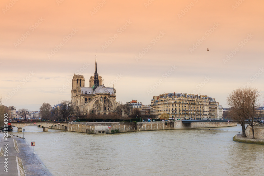 Beautiful sunset at the river Seine with the Notre-Dame Cathedral in Paris 