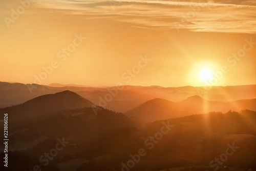 Beautfull sunset view around mountains. Sunlight on the sky with