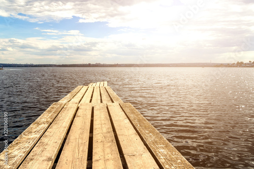 Wooden pier on the background of the sea