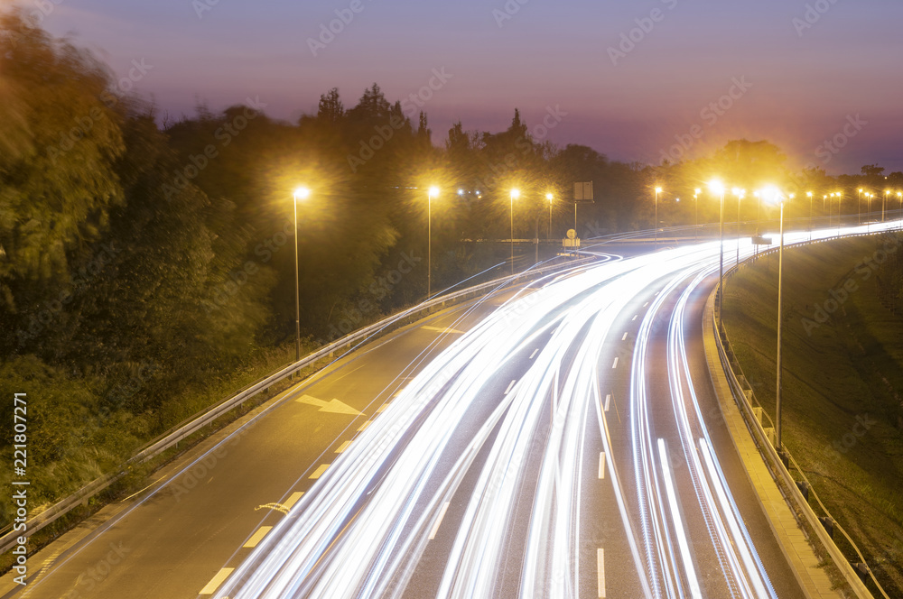 light trails on motorway highway at night, long exposure light trails on motorway highway at night, long exposure