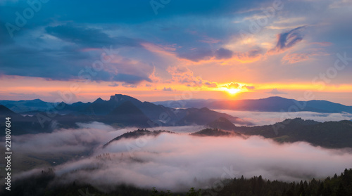 wonderful, beautiful sunset in the mountains. The fogs were illuminated by the setting sun © Mike Mareen