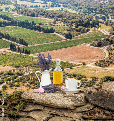 Fototapeta Naklejka Na Ścianę i Meble -  Lavender still life with cup of coffee against fields in Provence, France