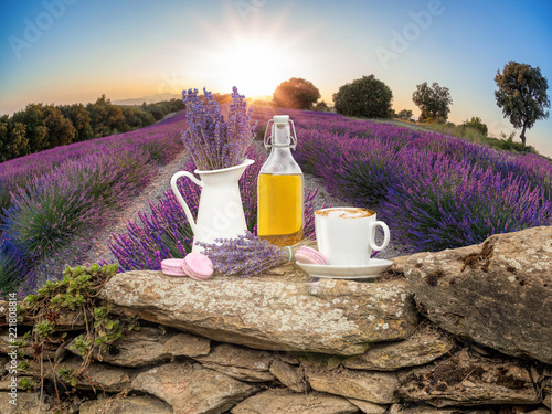 Fototapeta Naklejka Na Ścianę i Meble -  Lavender still life with cup of coffee against fields in Provence, France