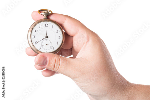 Female hand holding vintage clock isolated on a white background