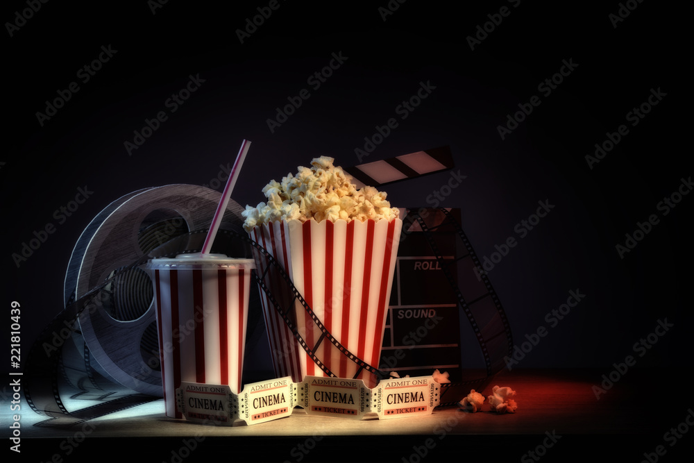 Fototapeta premium Vintage equipment and elements of cinema with dark background horizontal