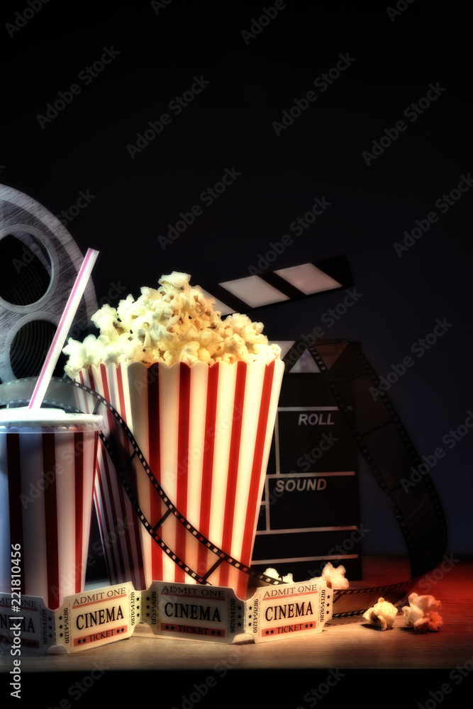 Fototapeta premium Vintage equipment and elements of cinema with dark background vertical