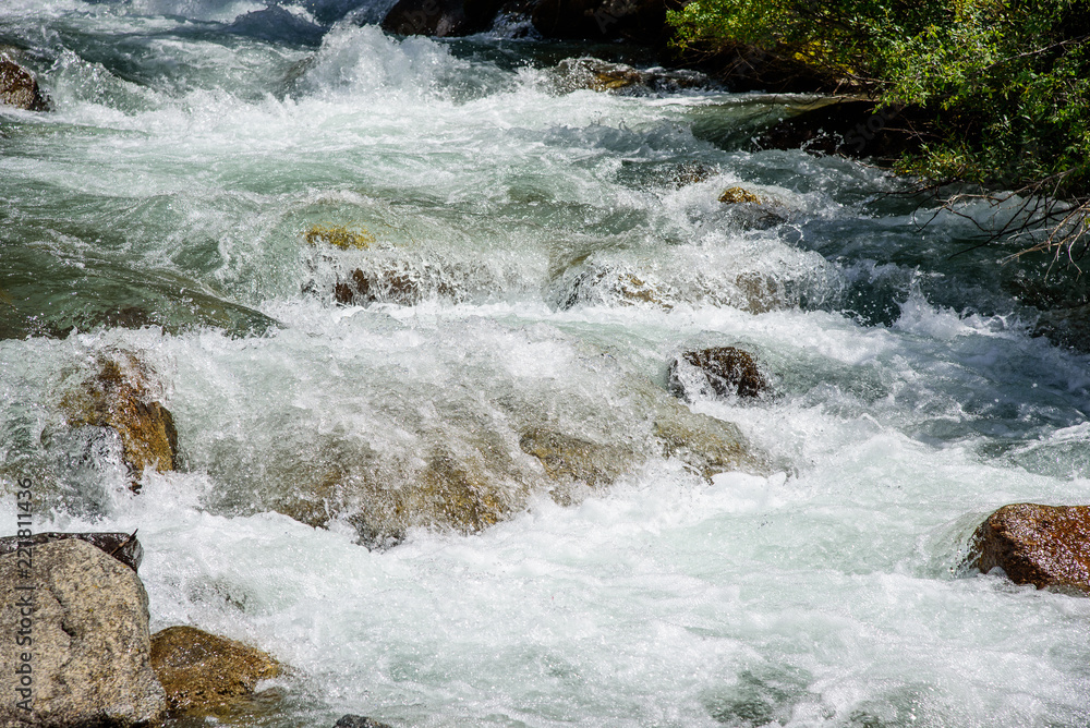 Fast mountain river in Kyrgyzstan. Sarah. Fast mountain river in Kyrgyzstan. Sarah.