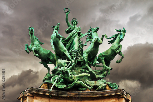 Quadriga statue on top of the Grand Palais in Paris. L'Immortalite devancant le Temps photo