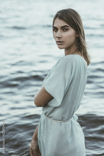 Fashion portrait of a beautiful, sensual girl on the sea