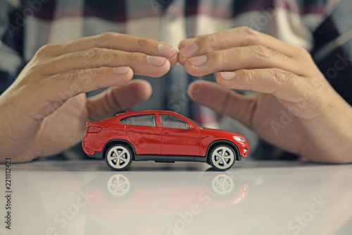 Male hands and car as protection of car concept