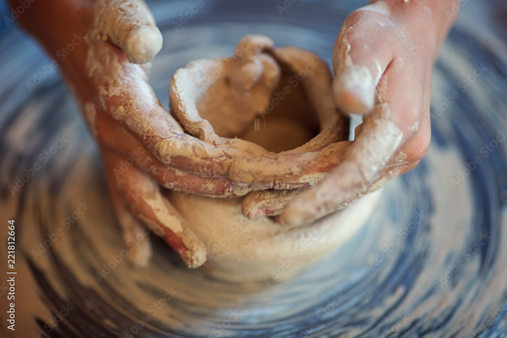 Fototapeta premium hands and Potter's wheel