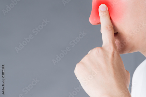 Fényképezés Man suffering from a sinusitis, studio shot on gray background