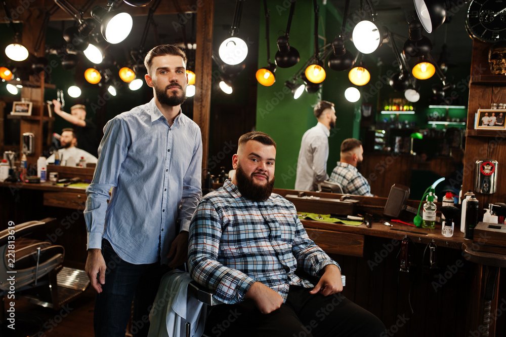 Handsome bearded man at the barbershop, barber at work. Handsome bearded man at the barbershop, barber at work.