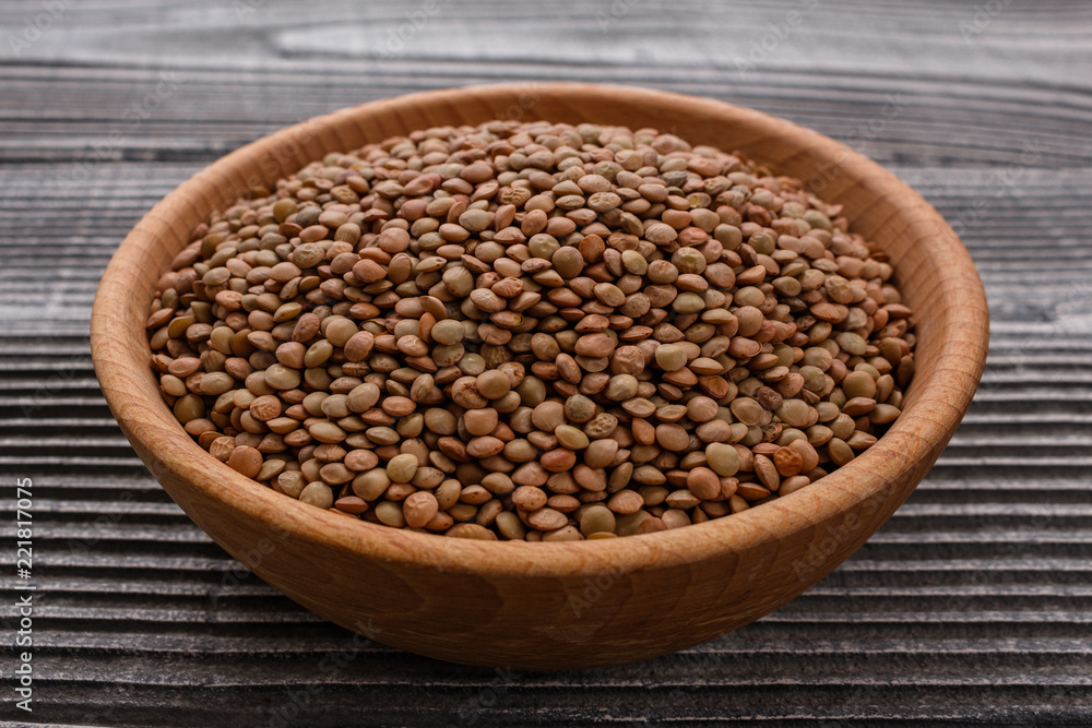 raw lentils on a wooden rustic background