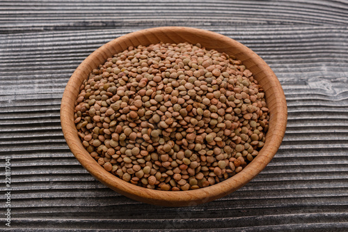 raw lentils on a wooden rustic background