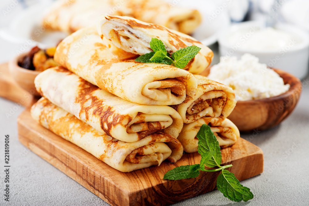 Thin pancakes stuffed with cottage cheese and raisins. 