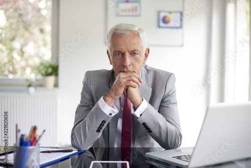 Executive financial director businessman looking thoughtfully