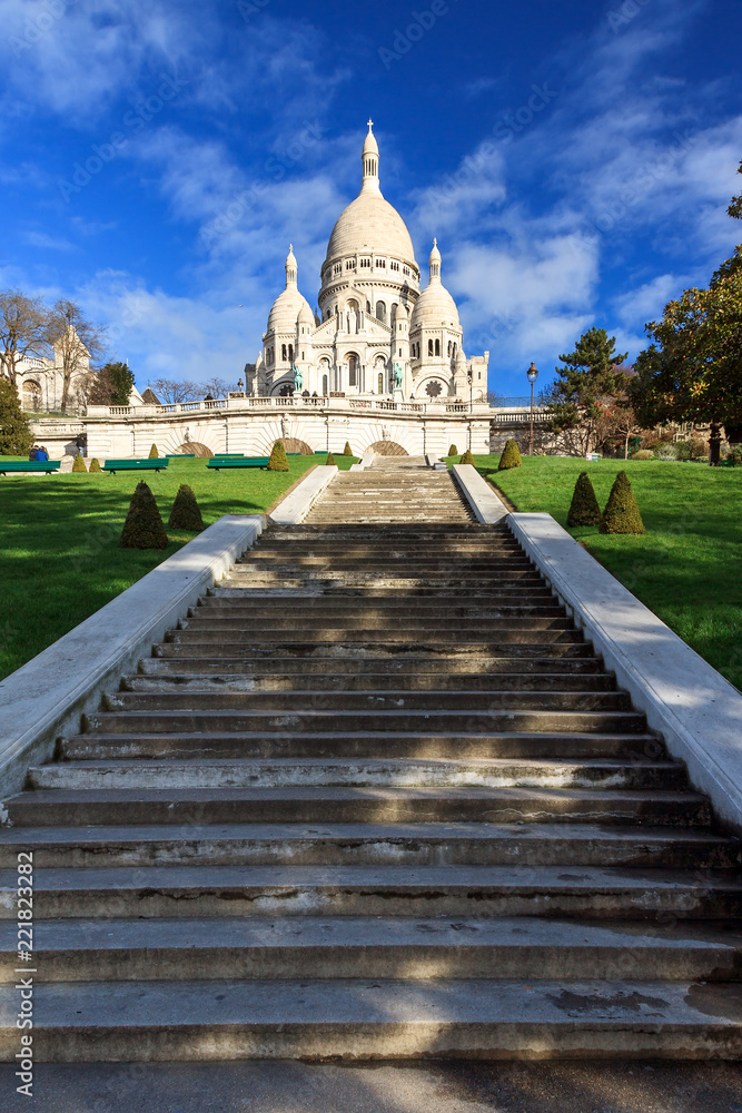 Beautiful view of the Basilica Sacre-Coeur in Paris, France, with a blue sky
