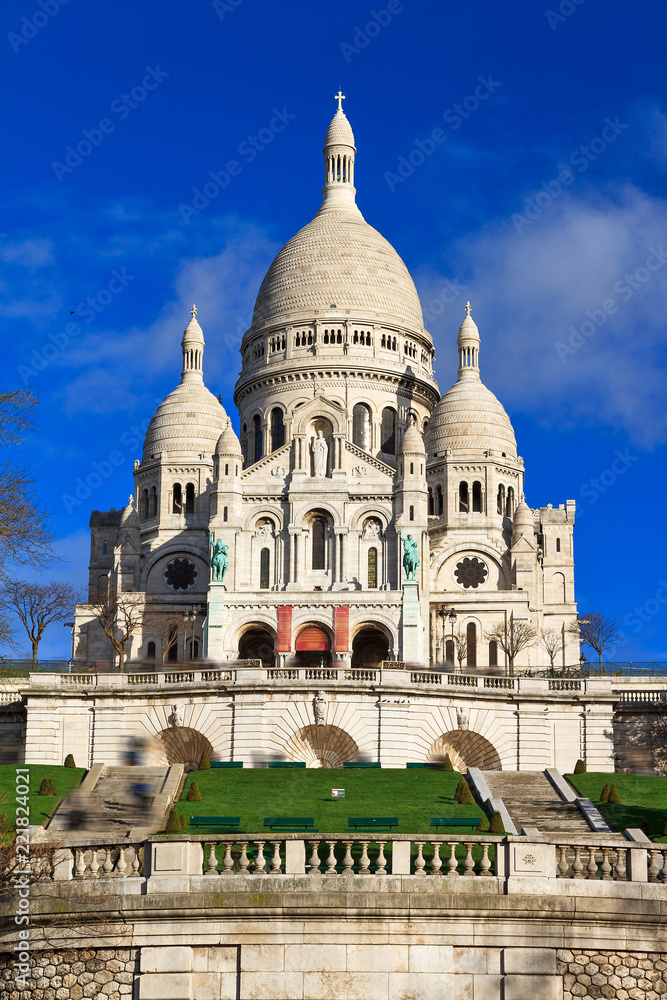 Beautiful view of the Basilica Sacre-Coeur in Paris, France, with a blue sky
