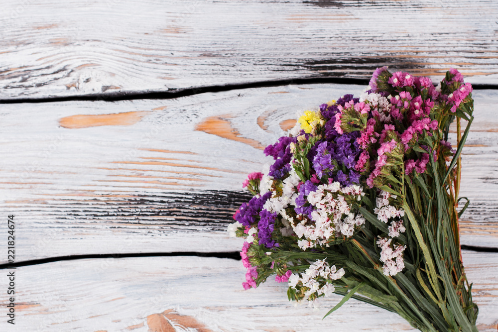 Bunch of flowers on wood. The beautiful lilac on a wooden background.