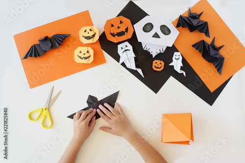 Lesson of origami. creativity. Hands of kids.
