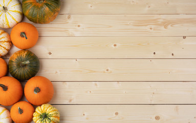 Pumpkins on wooden background