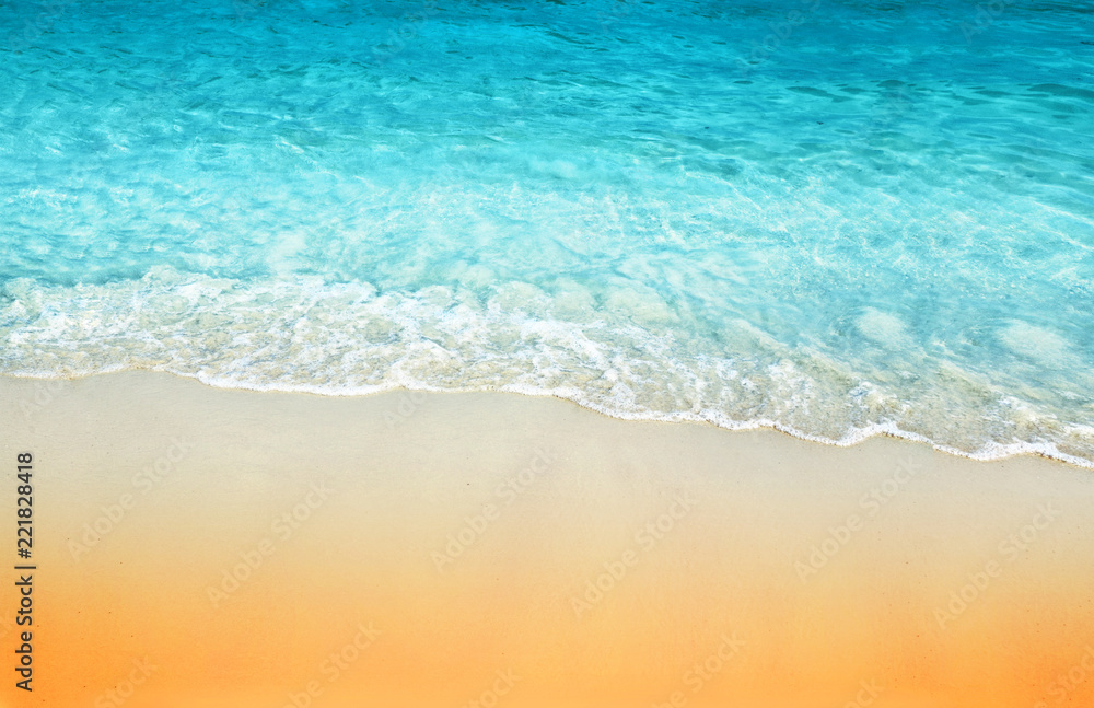 tropical sand beach and sea wave background