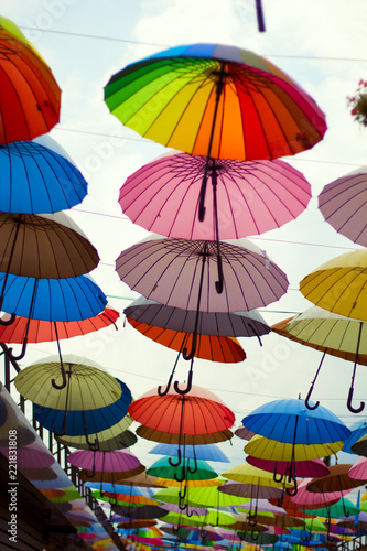 street decoration with bright umbrellas against the sky