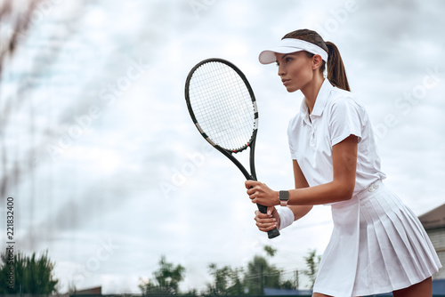 Woman playing tennis and waiting for the service © Friends Stock