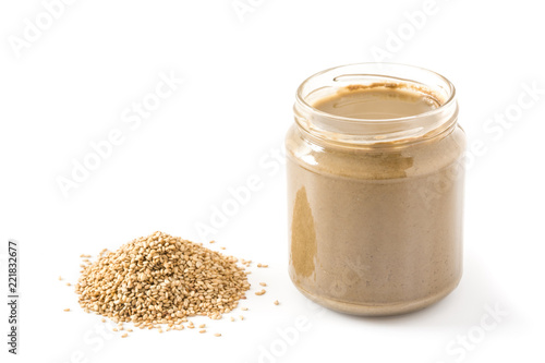Tahini and sesame seeds isolated on white background

