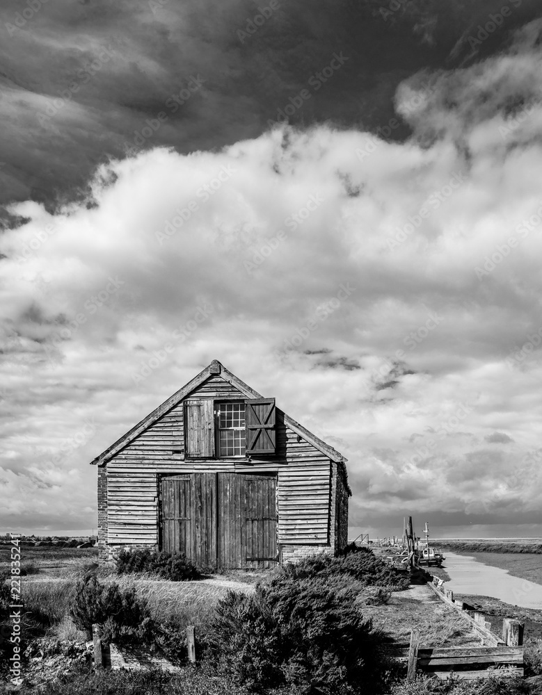 Abandoned Barn under clouds